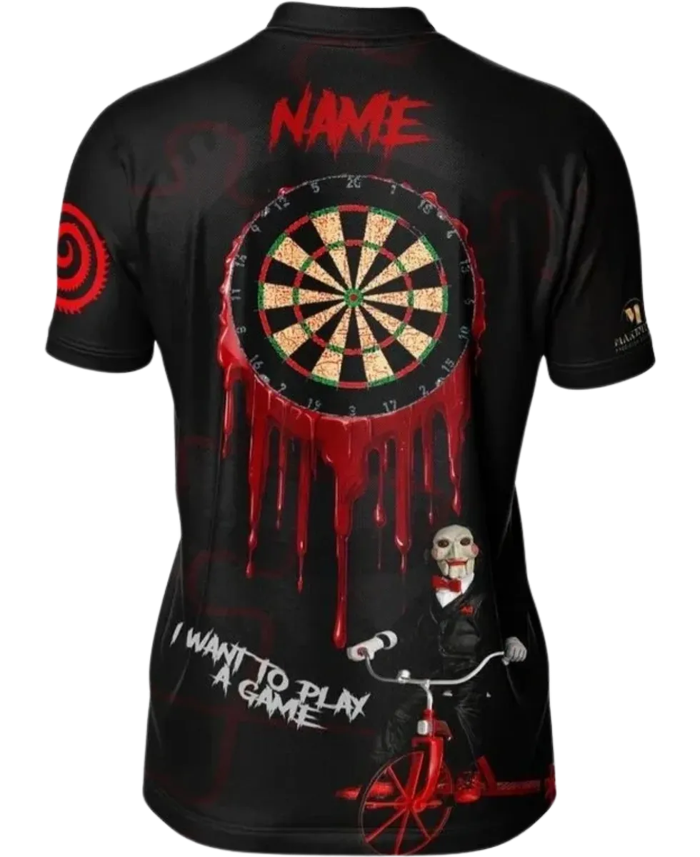 Black dart jersey with a graphic design of a saw inspired dartboard and the text "I want to play a game"  next to a ventriloquist doll on a red tricycle 